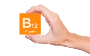 Tired person experiencing low energy from B12 deficiency